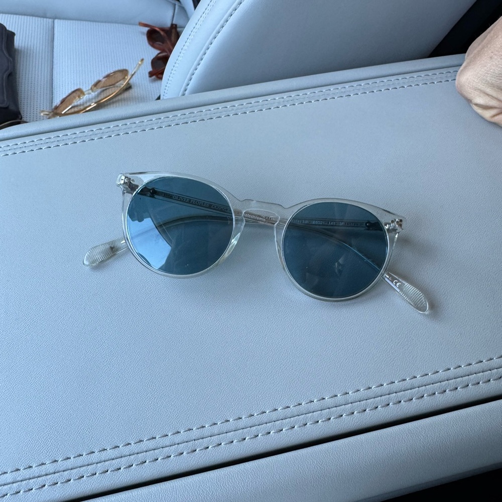 Clear Frame Oliver Peoples sunglasses with Blue Lenses